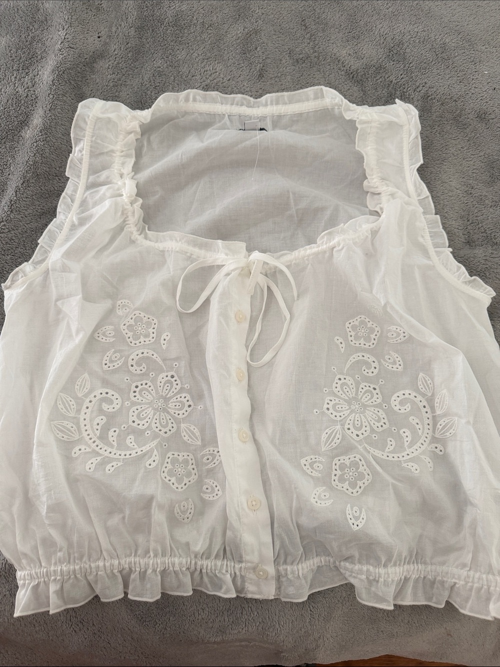 White Sleeveless Eyelet Tie-Neck Ruffle Blouse